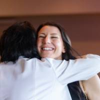 President Mantella hugging one of the reception attendees